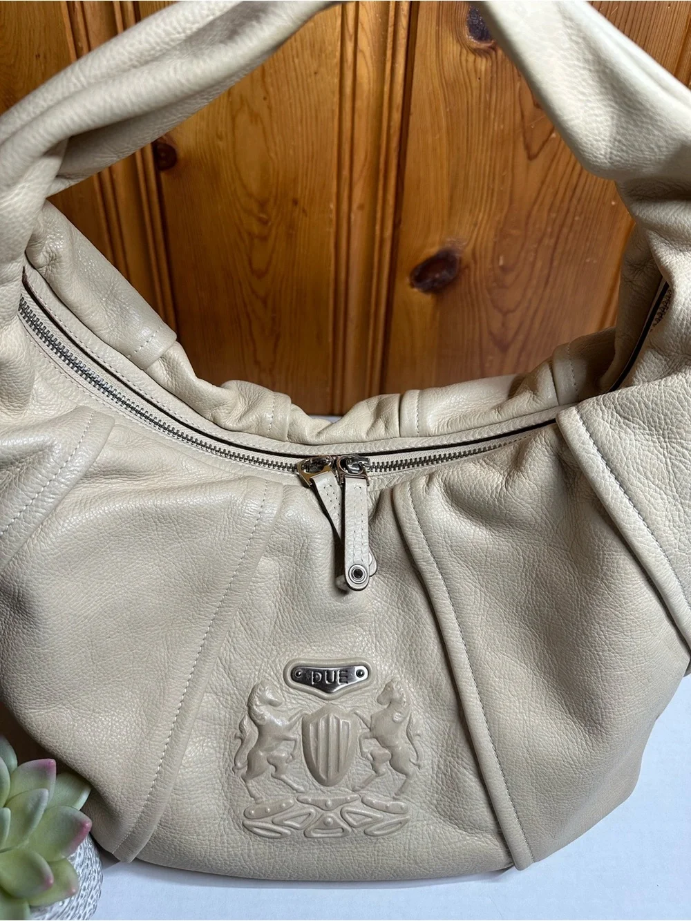 Cream Leather Shoulder Hobo Bag with Embossed Crest